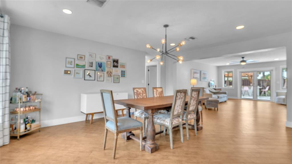2800 Northeast 53rd Street Lighthouse Point, FL 33064 - Photo 15 of 34 a view of a dining room with furniture and chandelier