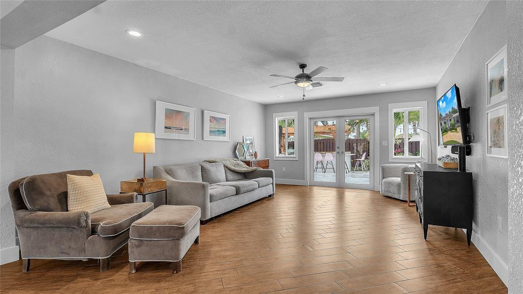 2800 Northeast 53rd Street Lighthouse Point, FL 33064 - Photo 16 of 34 a living room with furniture and a large window