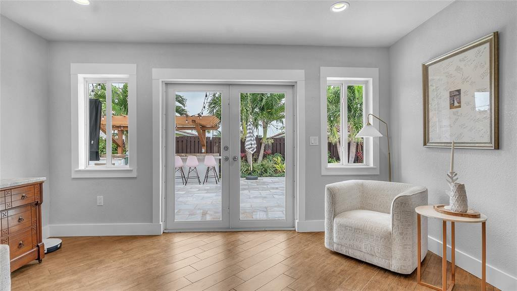 2800 Northeast 53rd Street Lighthouse Point, FL 33064 - Photo 18 of 34 a living room with furniture and a window