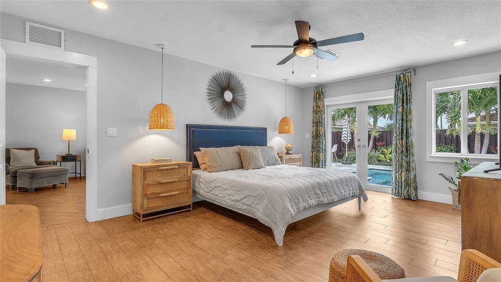 2800 Northeast 53rd Street Lighthouse Point, FL 33064 - Photo 21 of 34 a bedroom with a bed couch and window