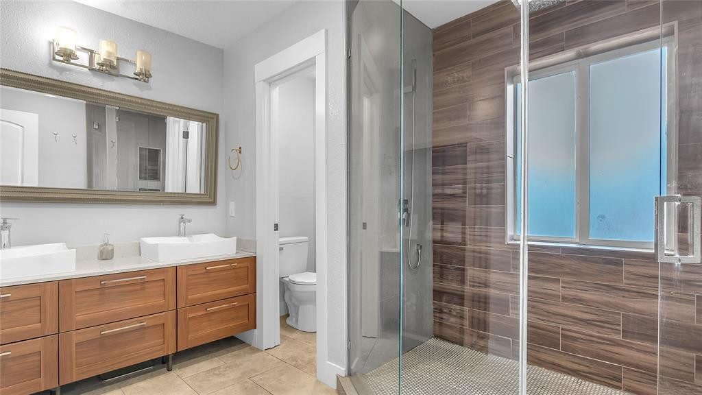 2800 Northeast 53rd Street Lighthouse Point, FL 33064 - Photo 25 of 34 a bathroom with a sink and a mirror