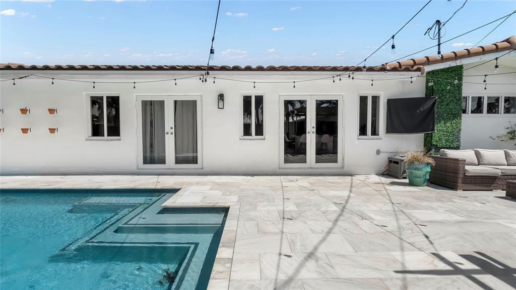 2800 Northeast 53rd Street Lighthouse Point, FL 33064 - Photo 30 of 34 a view of a house with backyard