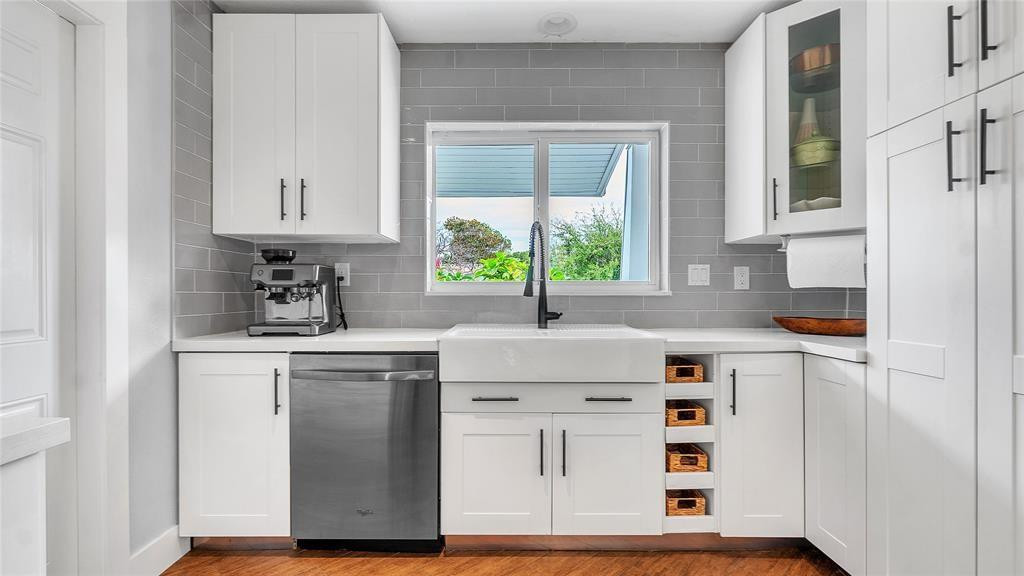 2800 Northeast 53rd Street Lighthouse Point, FL 33064 - Photo 7 of 34 a kitchen with cabinets appliances a sink and a window