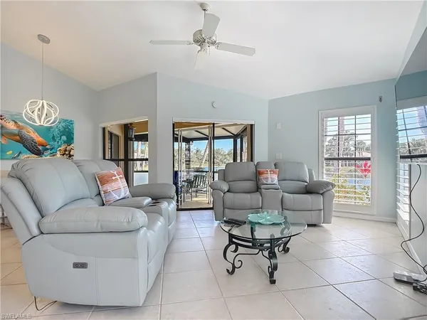 a living room with furniture and a rug