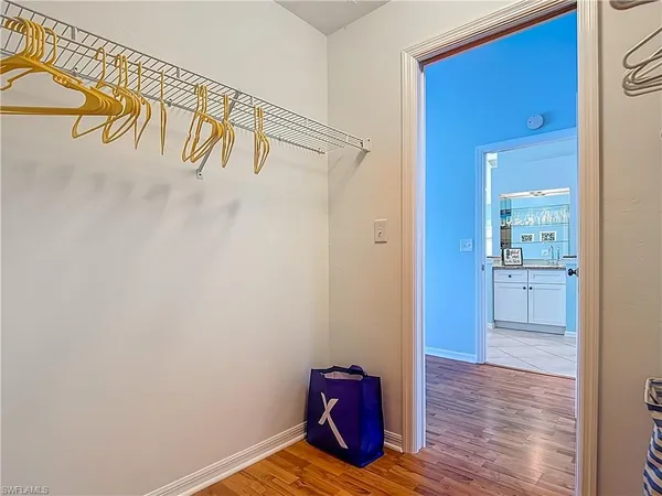 a view of front door with wooden floor