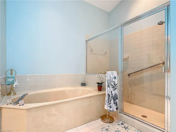 a bathroom with a bathtub and shower