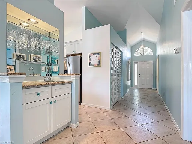 a bathroom with a sink a mirror and a shower