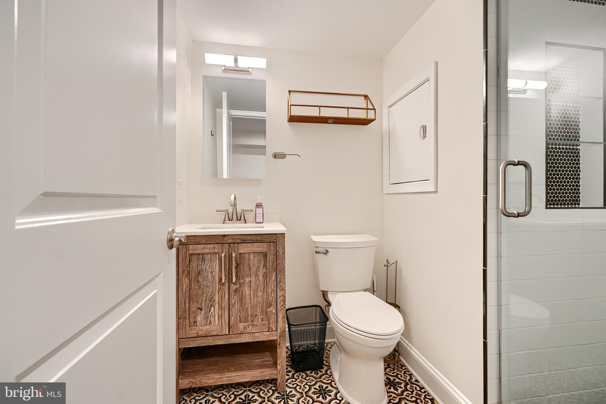 119 South Potomac Street Baltimore, MD 21224 - Photo 16 of 26 a bathroom with a sink toilet and shower