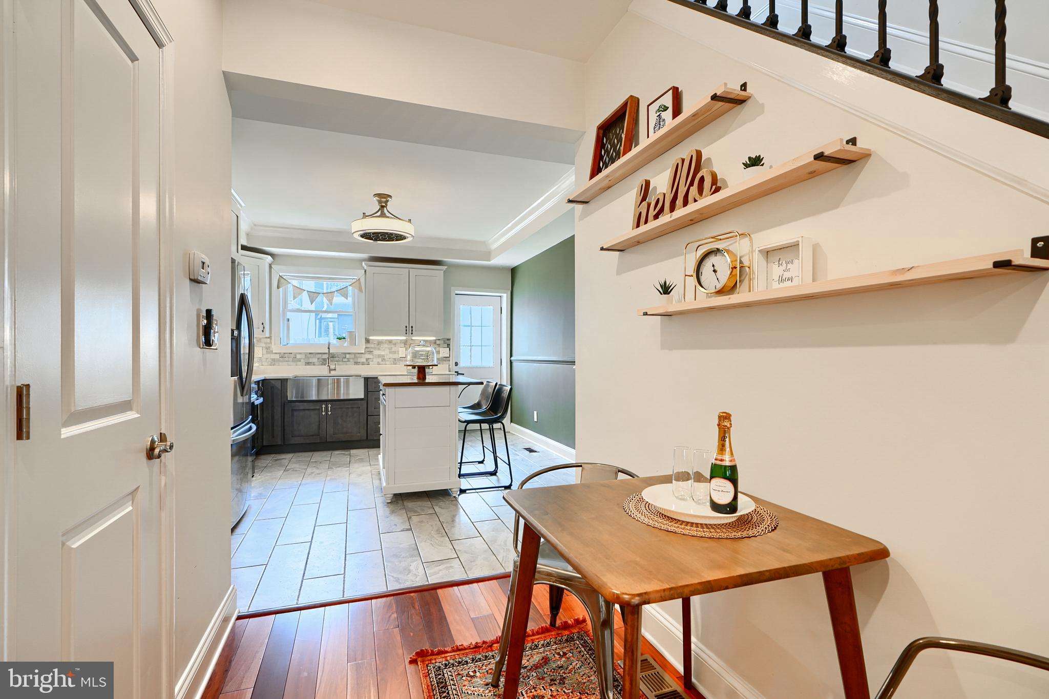 119 South Potomac Street Baltimore, MD 21224 - Photo 5 of 26 a view of a dining room with furniture and wooden floor