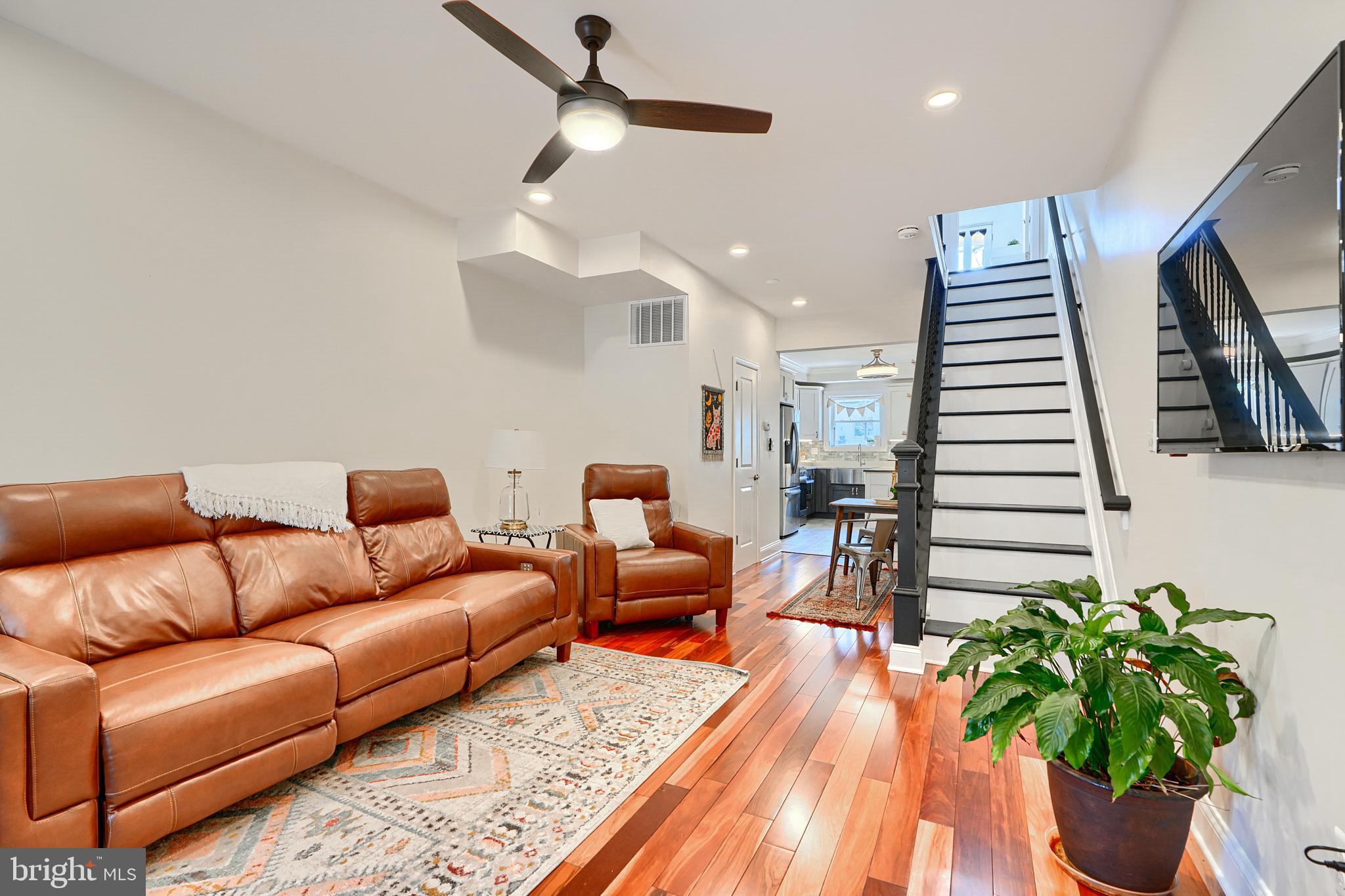 119 South Potomac Street Baltimore, MD 21224 - Photo 7 of 26 a living room with furniture and a potted plant