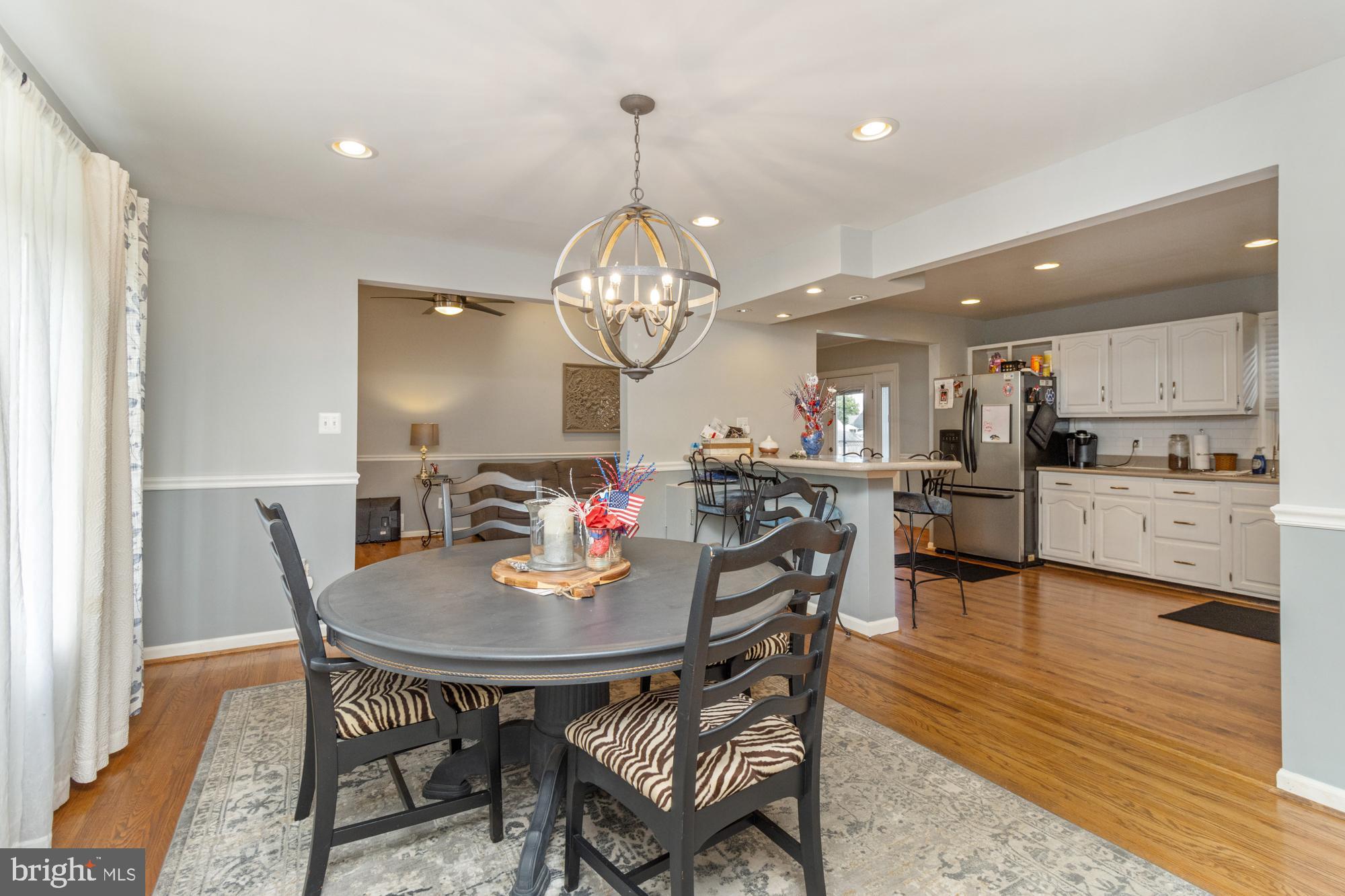 944 Homberg Avenue Baltimore, MD 21221 - Photo 11 of 50 a view of a dining room with furniture and wooden floor