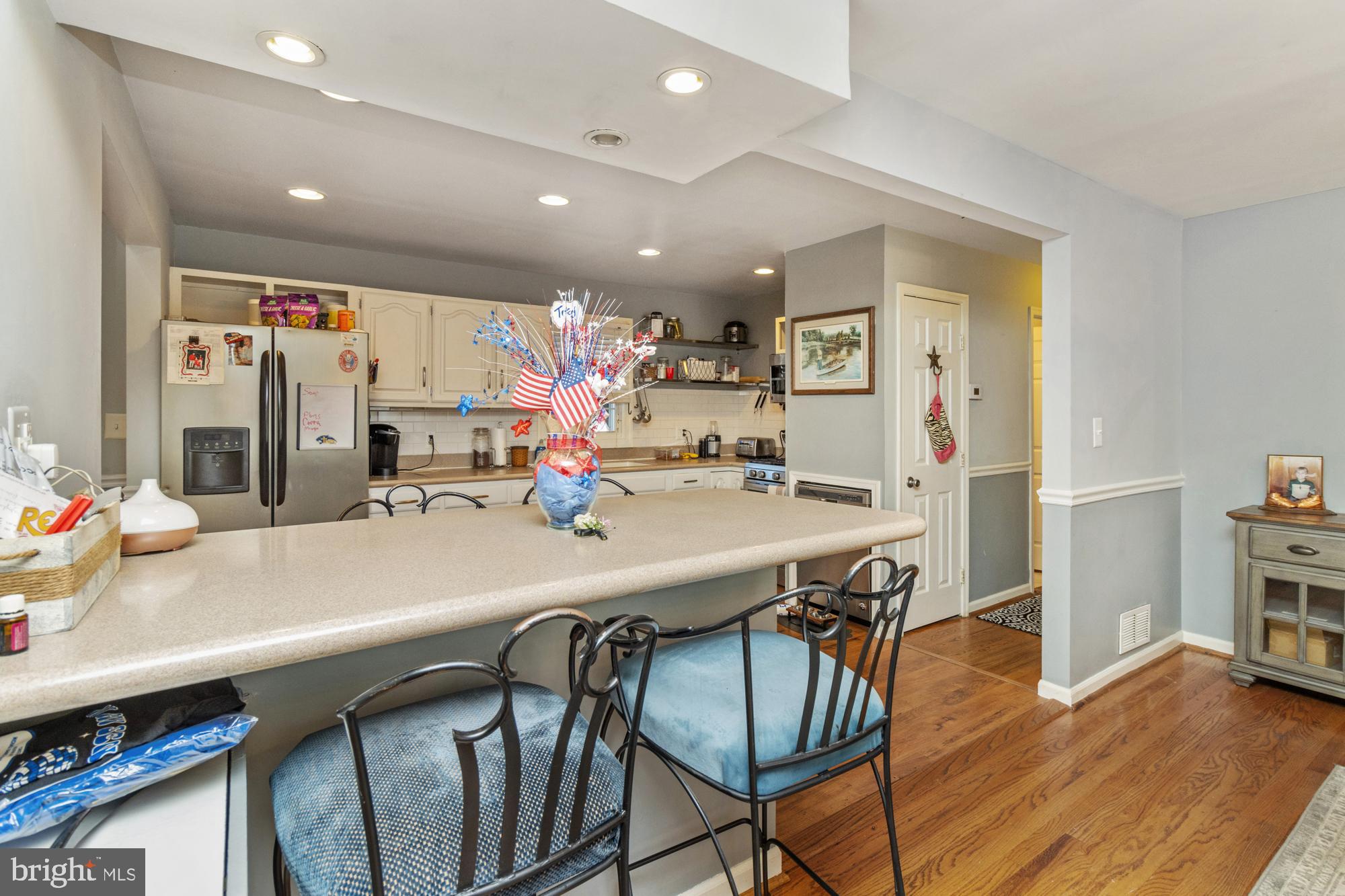 944 Homberg Avenue Baltimore, MD 21221 - Photo 13 of 50 a view of a dining room with furniture and wooden floor