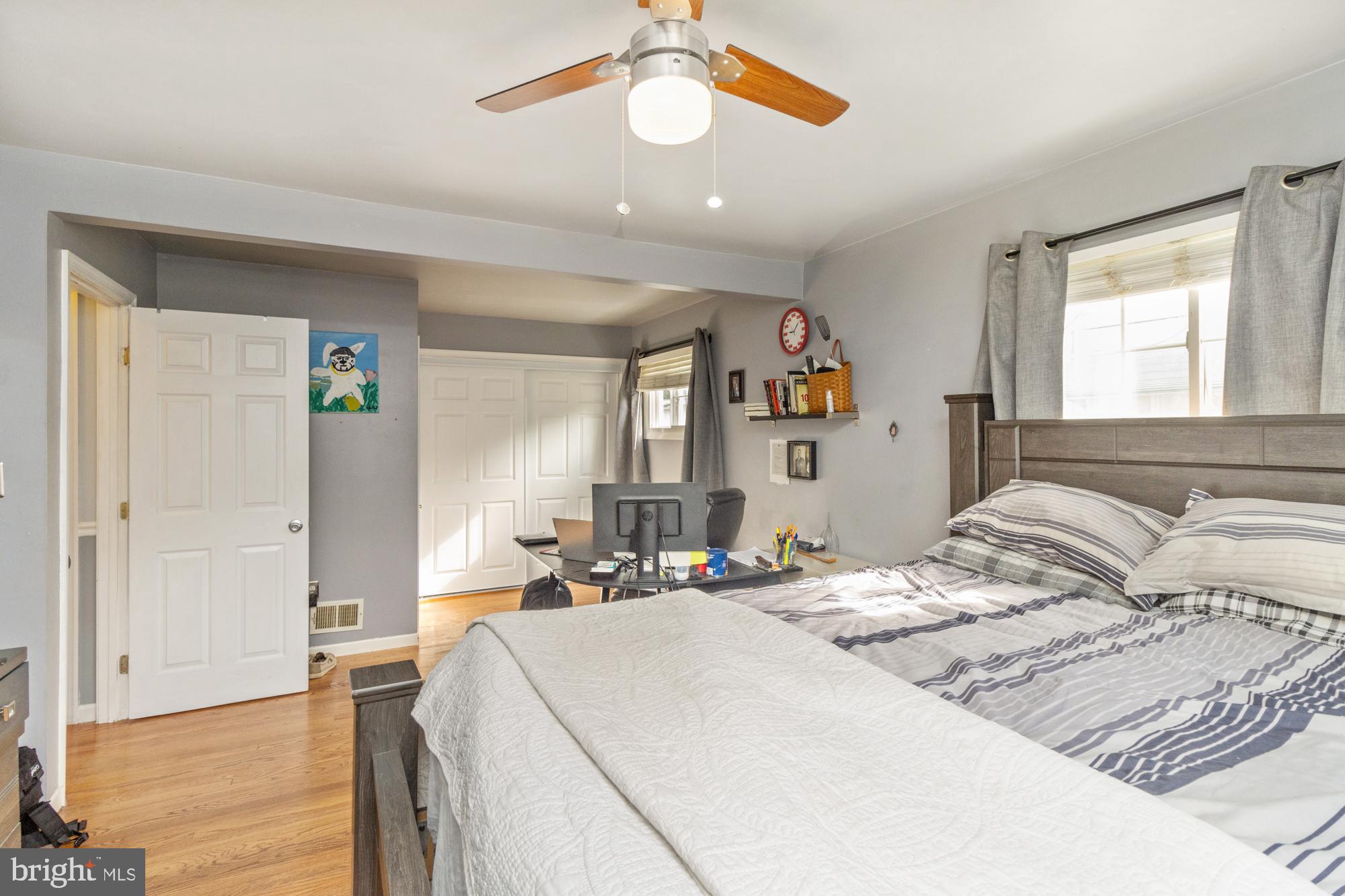 944 Homberg Avenue Baltimore, MD 21221 - Photo 18 of 50 a bedroom with a bed and a chandelier