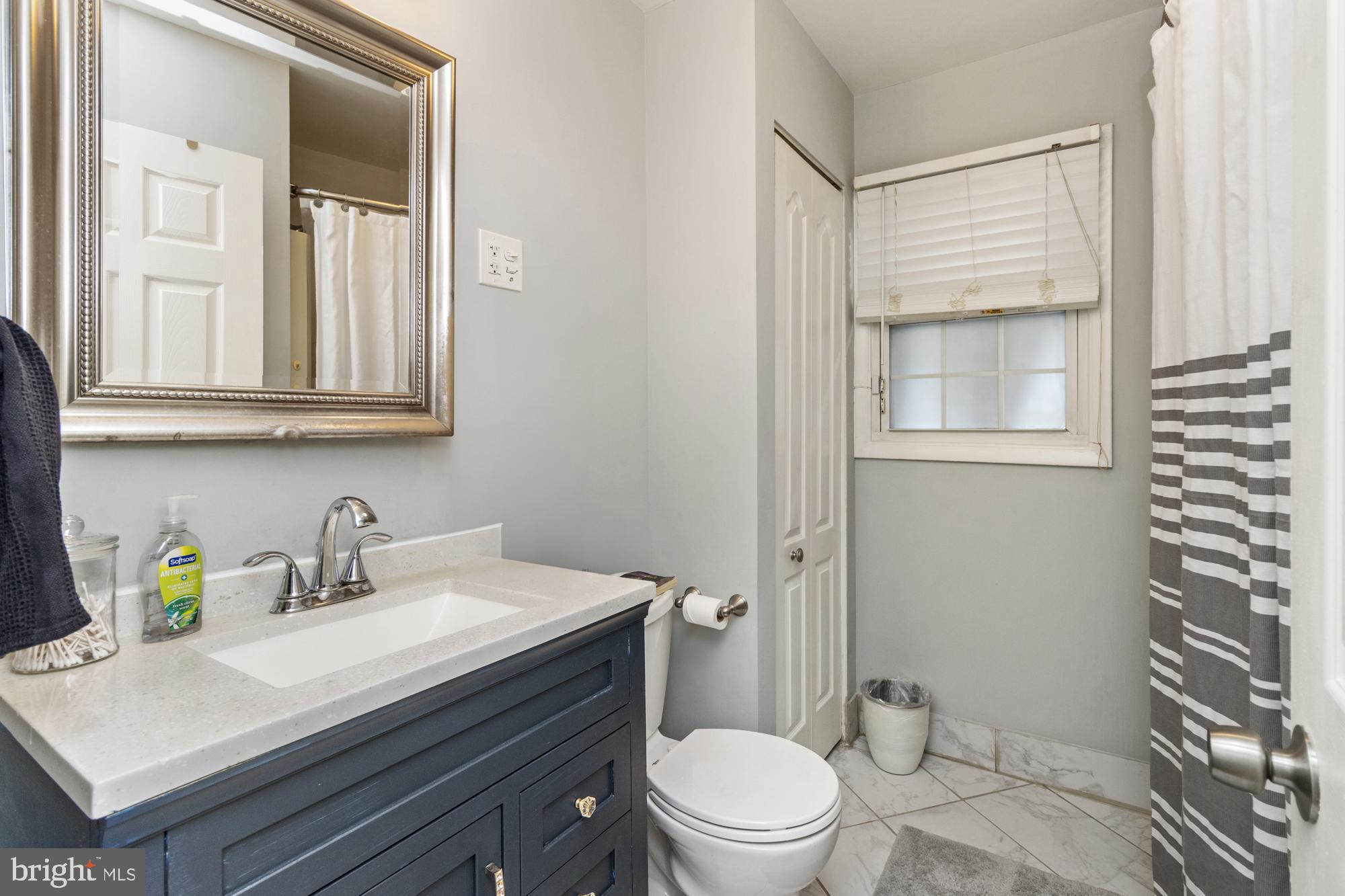 944 Homberg Avenue Baltimore, MD 21221 - Photo 20 of 50 a bathroom with a sink a toilet and shower