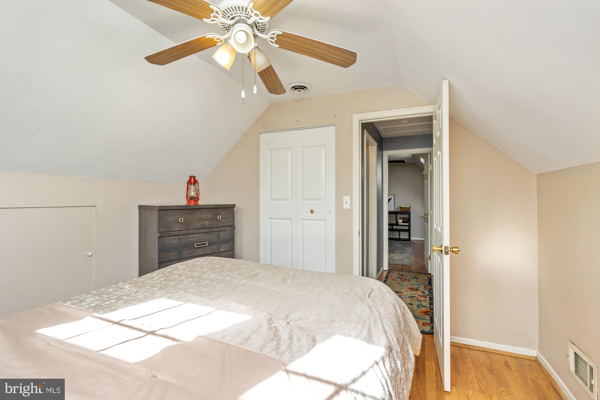 944 Homberg Avenue Baltimore, MD 21221 - Photo 25 of 50 a bedroom with a bed and a chandelier