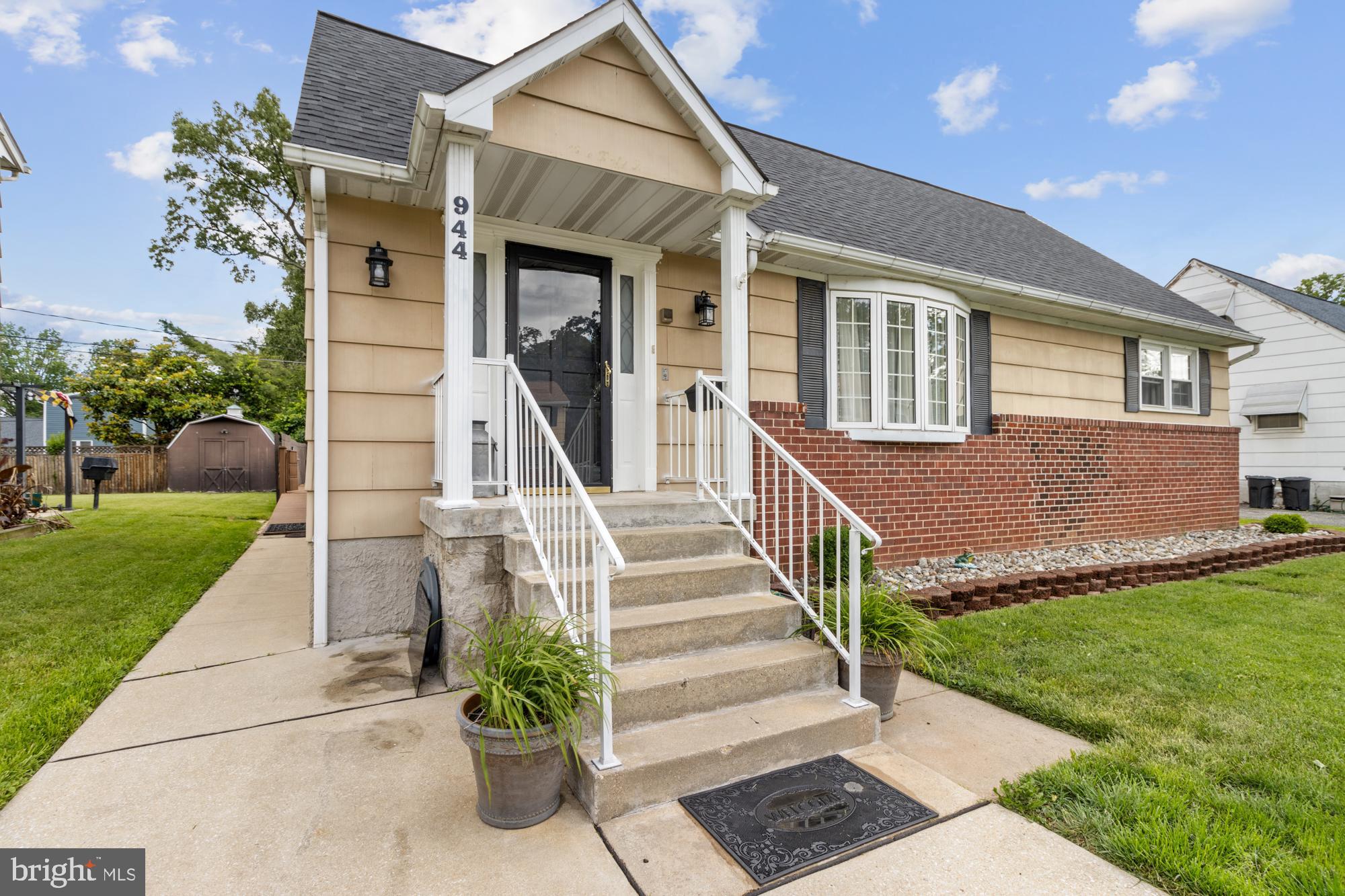 944 Homberg Avenue Baltimore, MD 21221 - Photo 3 of 50 a front view of a house with a yard