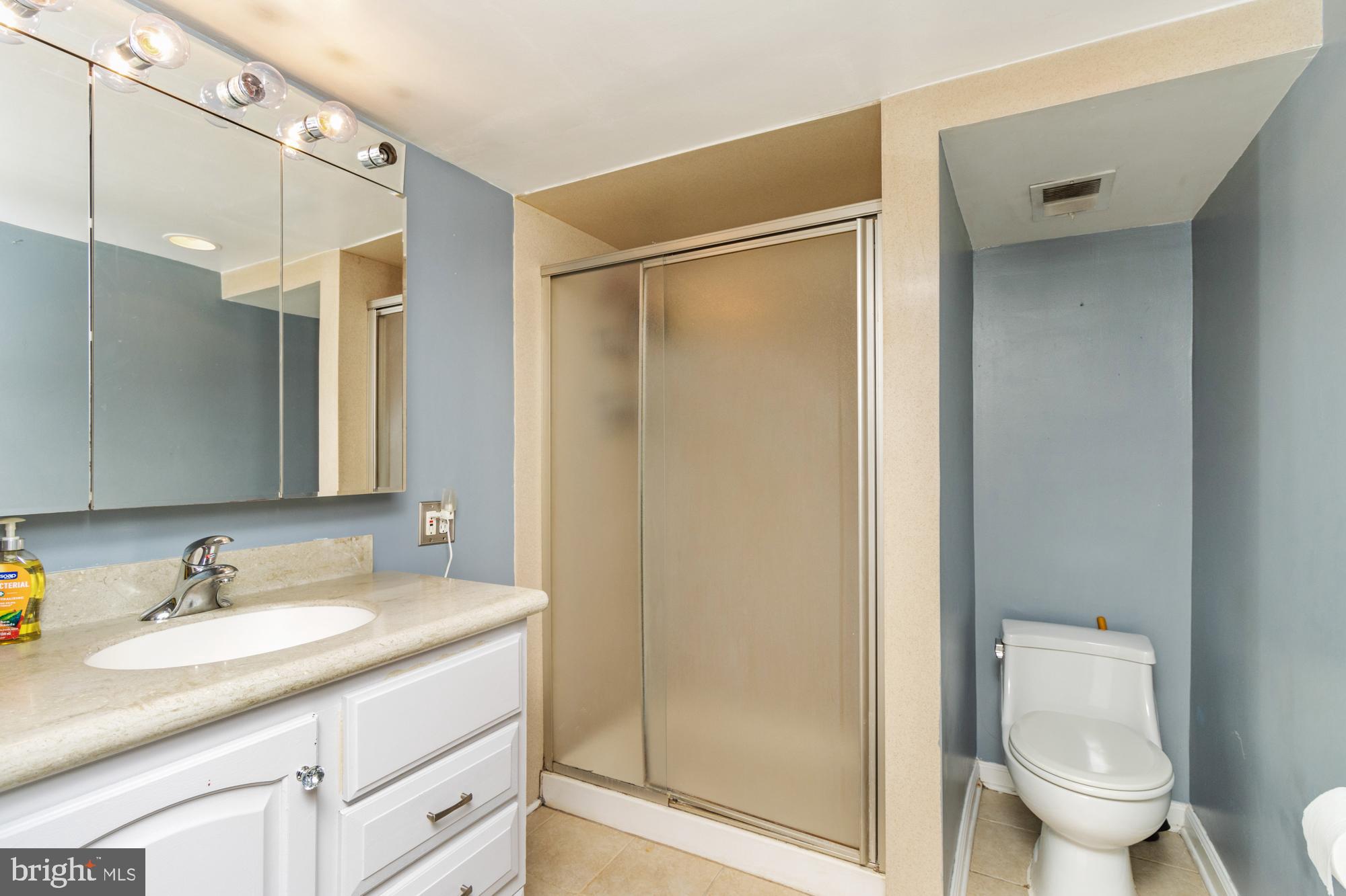 944 Homberg Avenue Baltimore, MD 21221 - Photo 33 of 50 a bathroom with a granite countertop sink toilet and shower