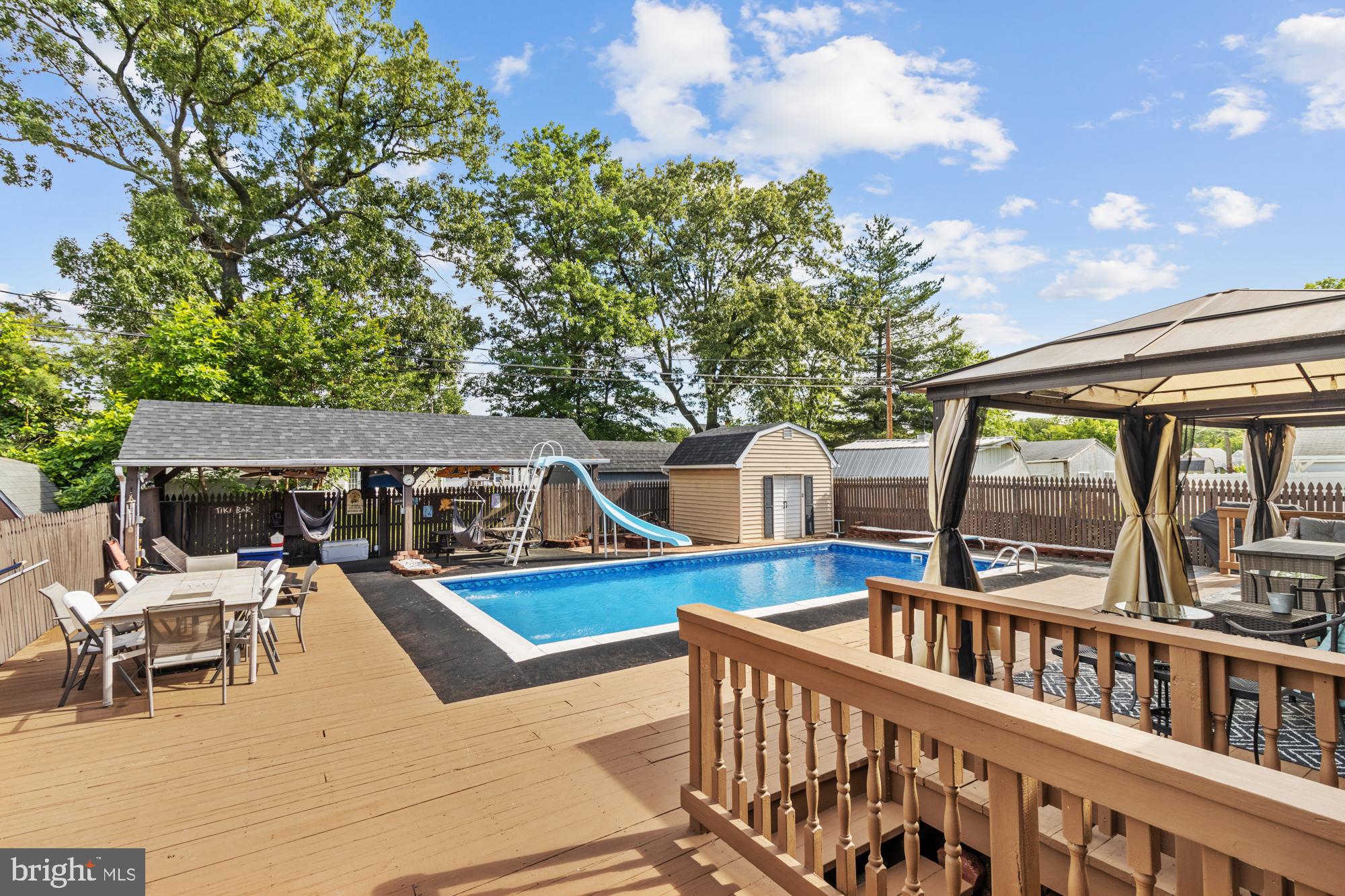 944 Homberg Avenue Baltimore, MD 21221 - Photo 36 of 50 a view of a patio with couches table and chairs and potted plants
