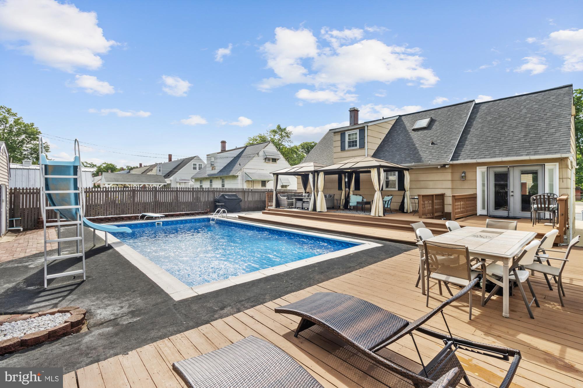 944 Homberg Avenue Baltimore, MD 21221 - Photo 40 of 50 a view of a patio with swimming pool table and chairs