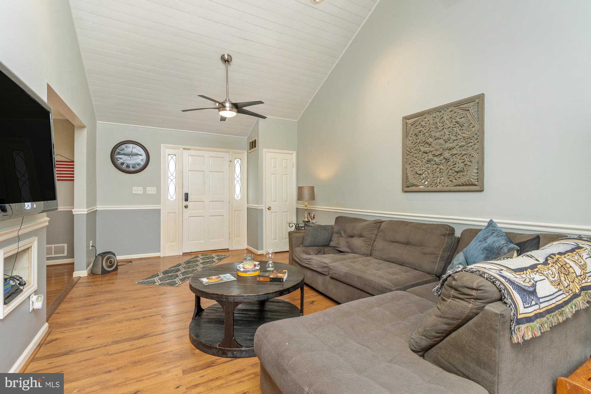 944 Homberg Avenue Baltimore, MD 21221 - Photo 6 of 50 a living room with furniture and a flat screen tv