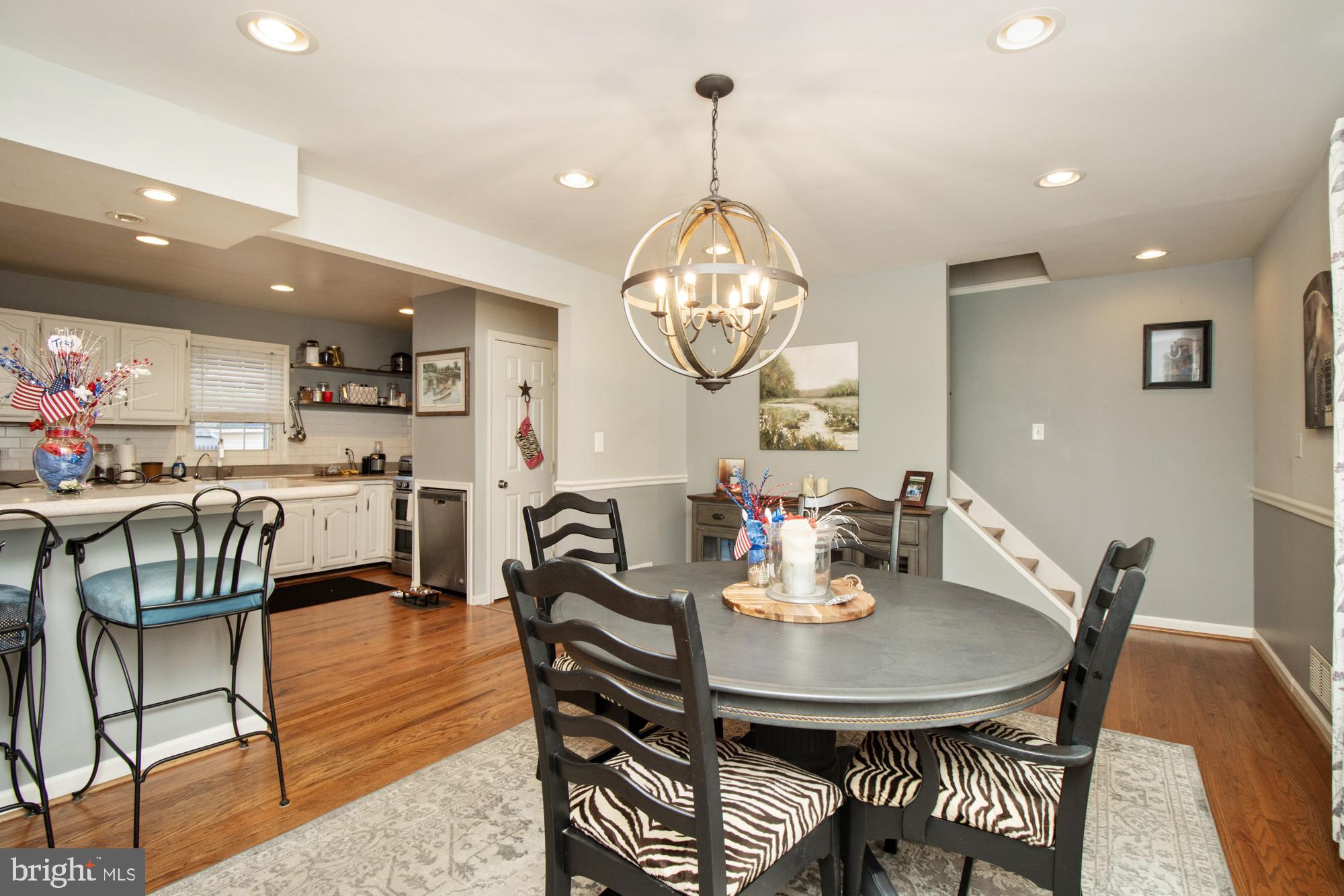 944 Homberg Avenue Baltimore, MD 21221 - Photo 8 of 50 a view of a dining room with furniture and a chandelier