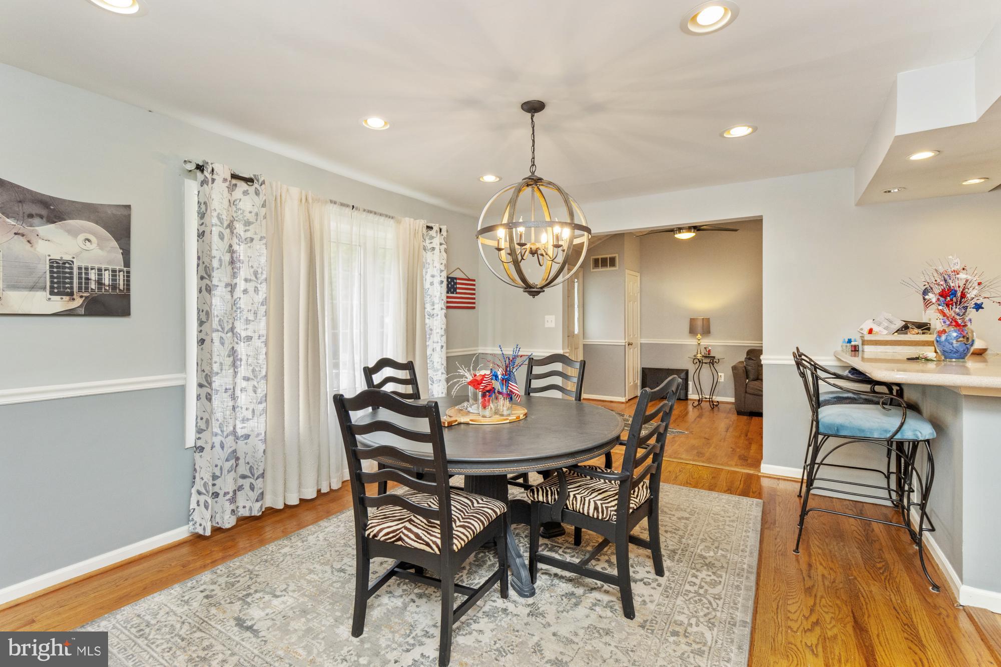 944 Homberg Avenue Baltimore, MD 21221 - Photo 10 of 50 a view of a dining room with furniture window and wooden floor