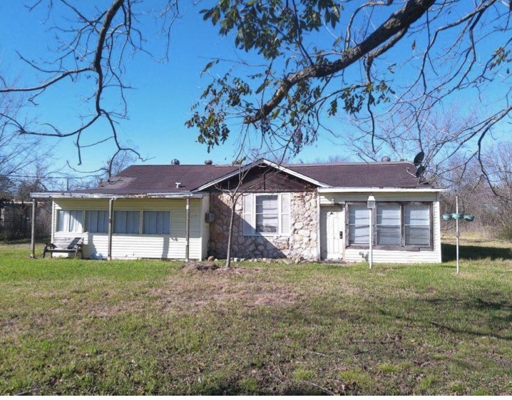 1023 Becker Street Channelview, TX 77530 - Photo 3 of 8 a front view of a house with a yard