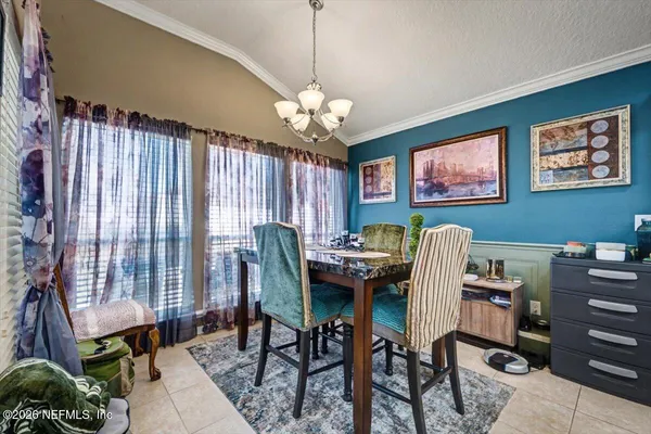 a view of a livingroom with furniture and a window