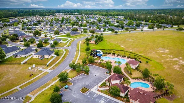 an aerial view of residential houses with outdoor space