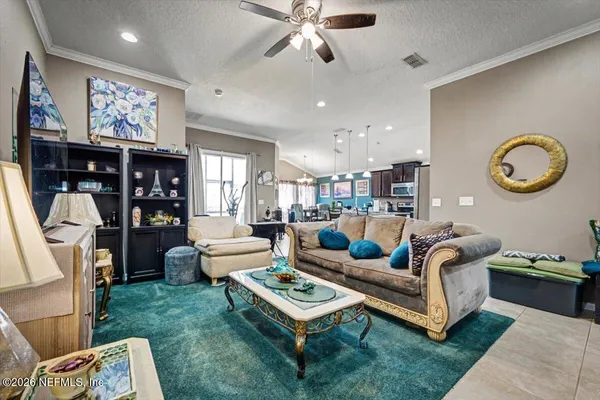 a living room with furniture and a fireplace