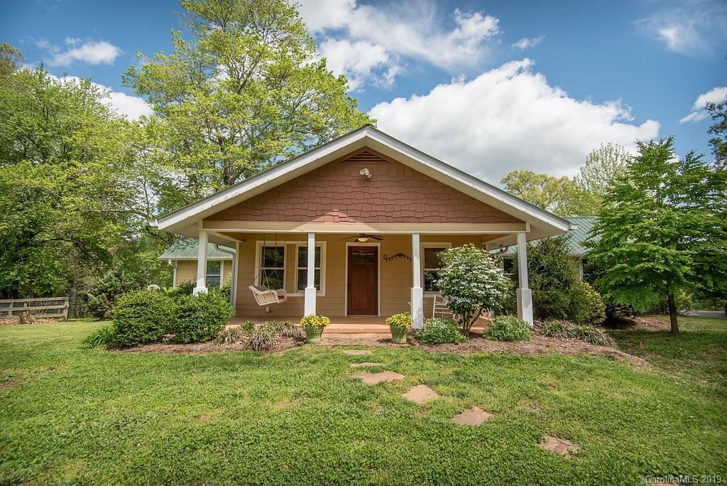 435 Landrum Road Columbus, NC 28722 - Photo 2 of 22 a front view of house with yard and green space