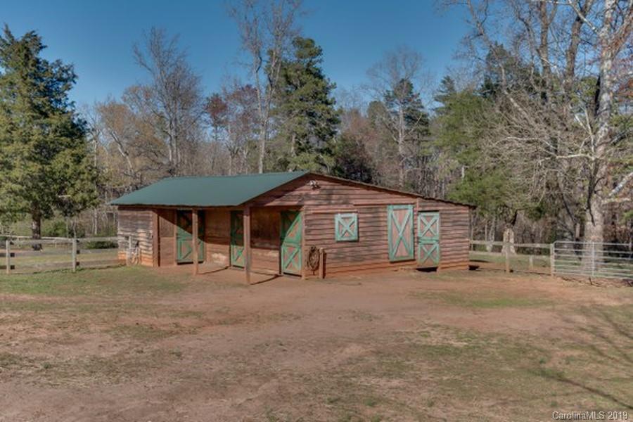 435 Landrum Road Columbus, NC 28722 - Photo 18 of 22 a view of a house with a yard
