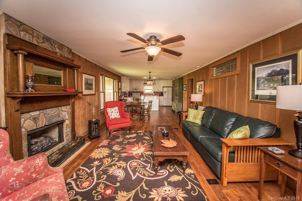 435 Landrum Road Columbus, NC 28722 - Photo 3 of 22 a living room with furniture and a fireplace