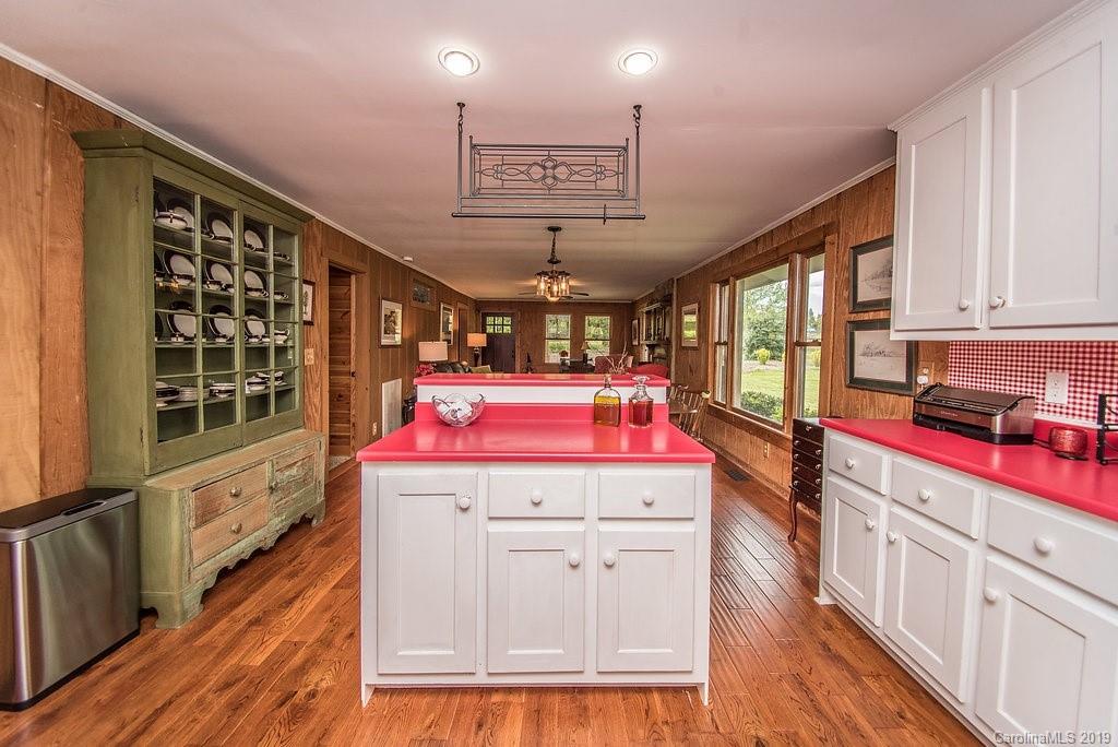 435 Landrum Road Columbus, NC 28722 - Photo 6 of 22 a view of a kitchen with cabinets and wooden floor