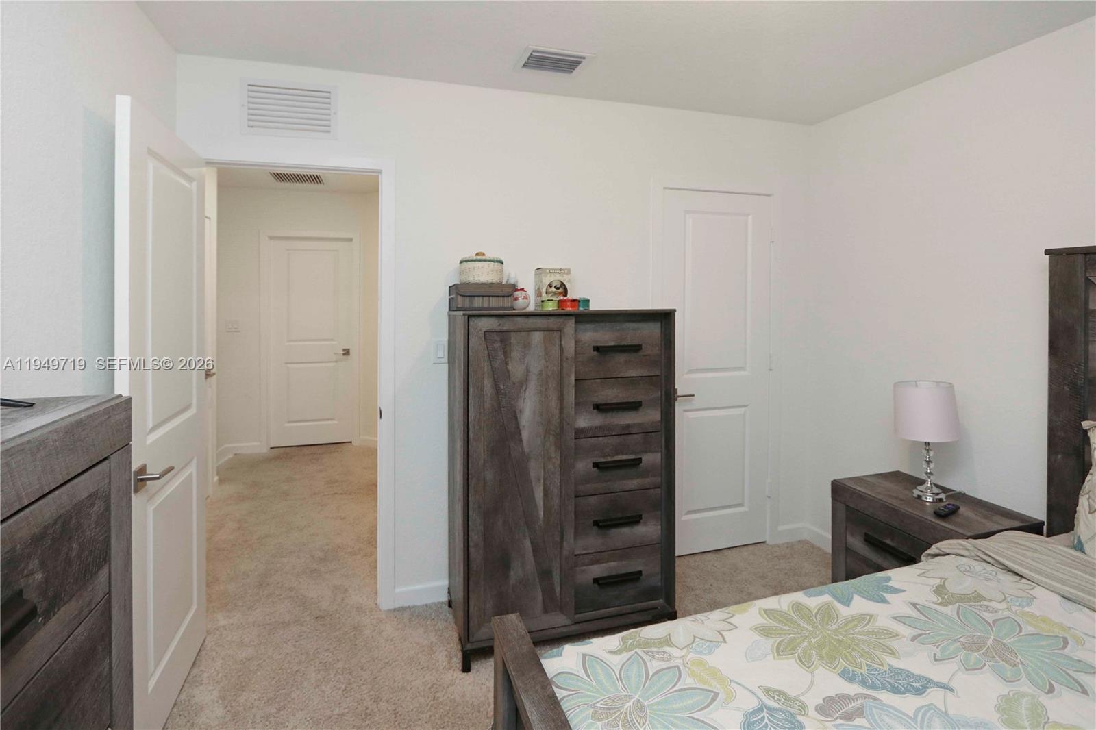 2432 Southeast 10th Street Homestead, FL 33035 - Photo 17 of 30 a bedroom with a bed and a television