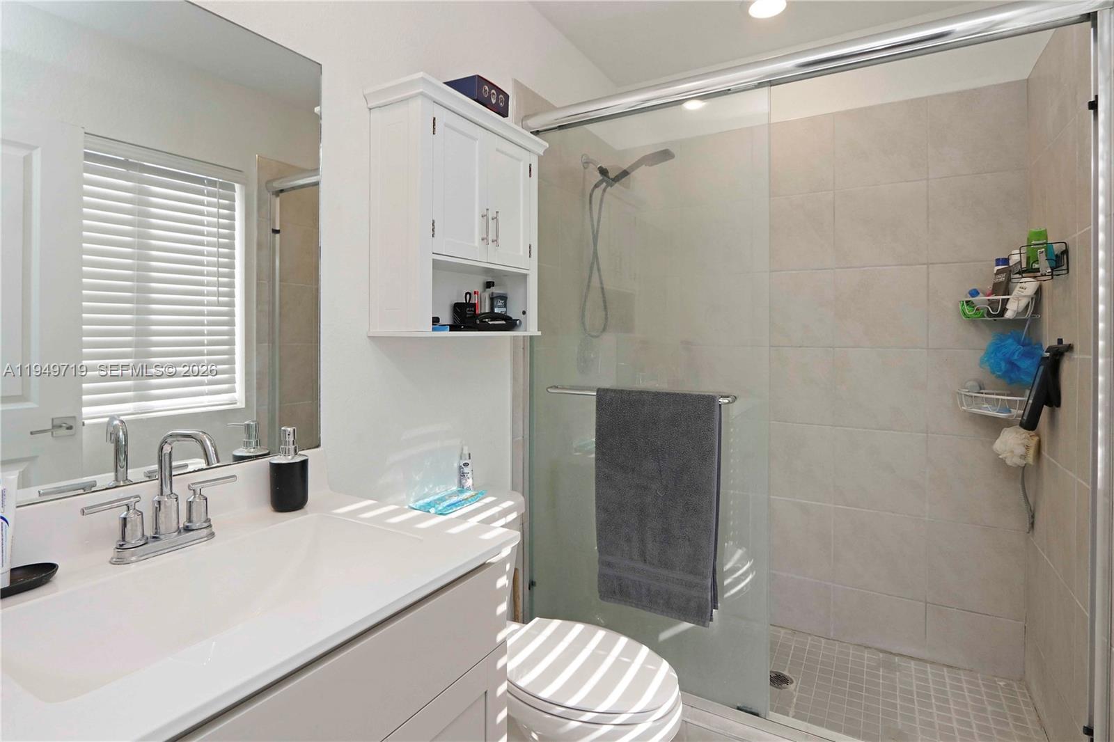 2432 Southeast 10th Street Homestead, FL 33035 - Photo 21 of 30 a bathroom with a sink toilet and shower