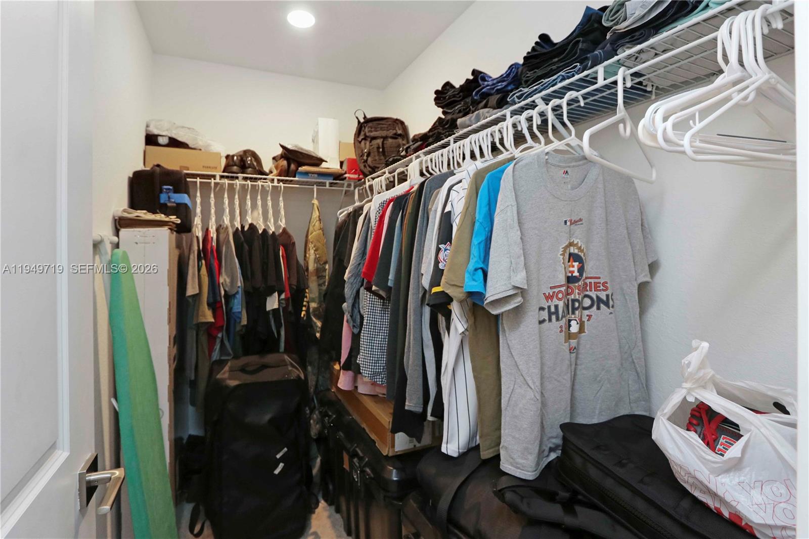 2432 Southeast 10th Street Homestead, FL 33035 - Photo 22 of 30 a view of walk in closet with clothes and shoes