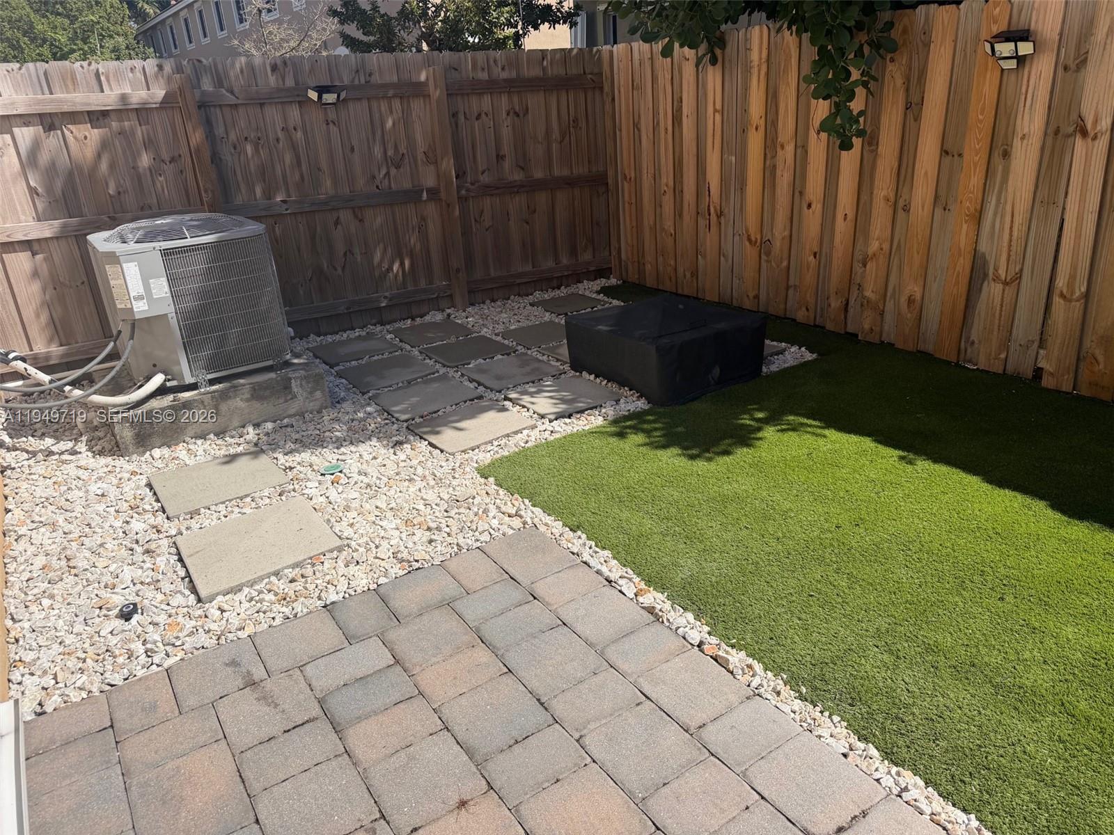 2432 Southeast 10th Street Homestead, FL 33035 - Photo 26 of 30 a view of a backyard with wooden fence