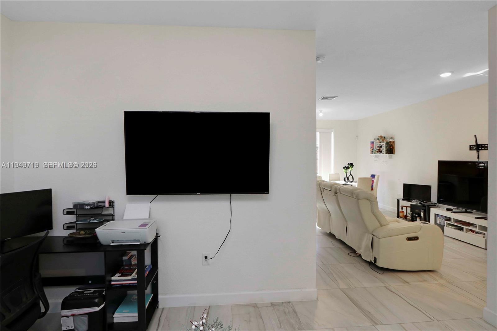 2432 Southeast 10th Street Homestead, FL 33035 - Photo 4 of 30 a living room with furniture and a flat screen tv