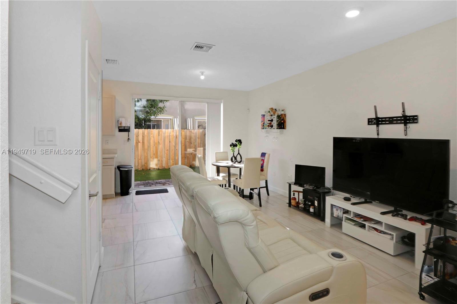 2432 Southeast 10th Street Homestead, FL 33035 - Photo 5 of 30 a living room with furniture and a flat screen tv