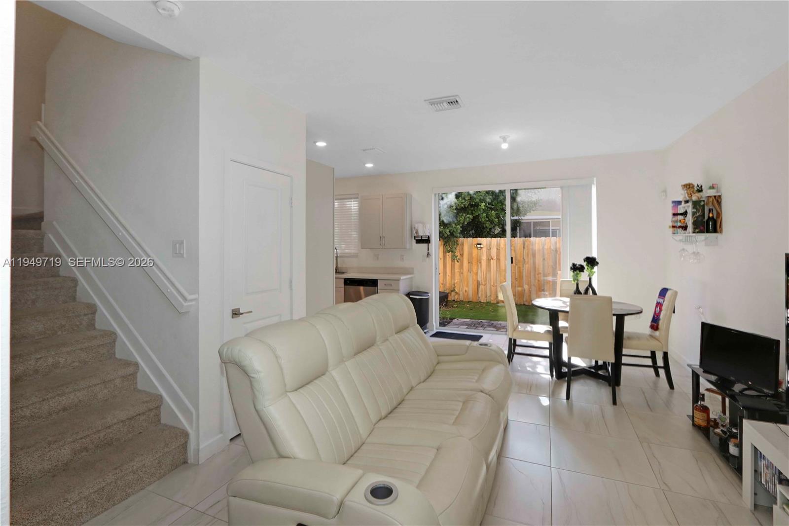 2432 Southeast 10th Street Homestead, FL 33035 - Photo 6 of 30 a living room with furniture and a flat screen tv