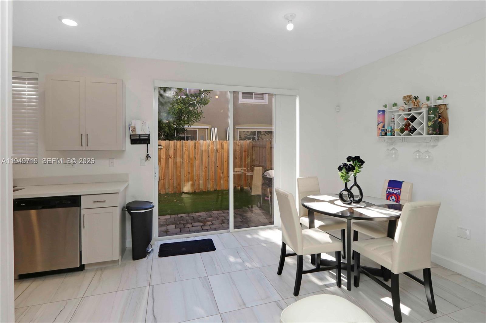 2432 Southeast 10th Street Homestead, FL 33035 - Photo 7 of 30 a kitchen with a table and chairs