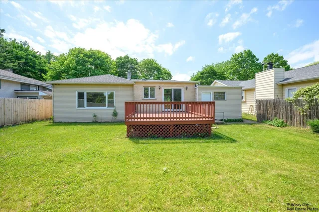 a view of a house with backyard and porch