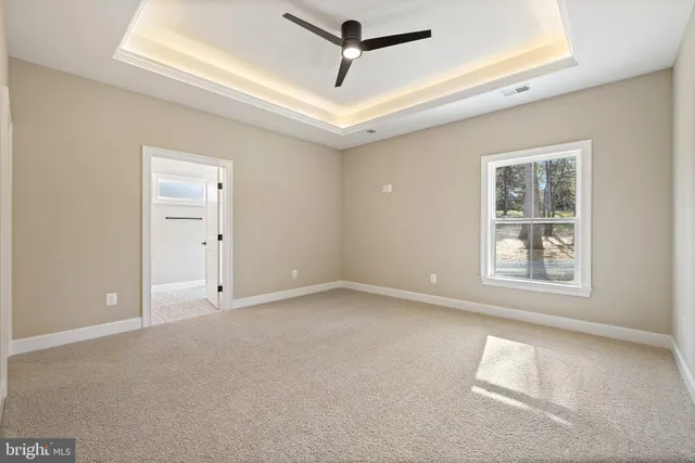 a bathroom with double vanity sinks and a mirror