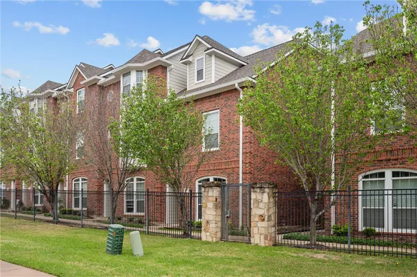 front view of a house with a garden