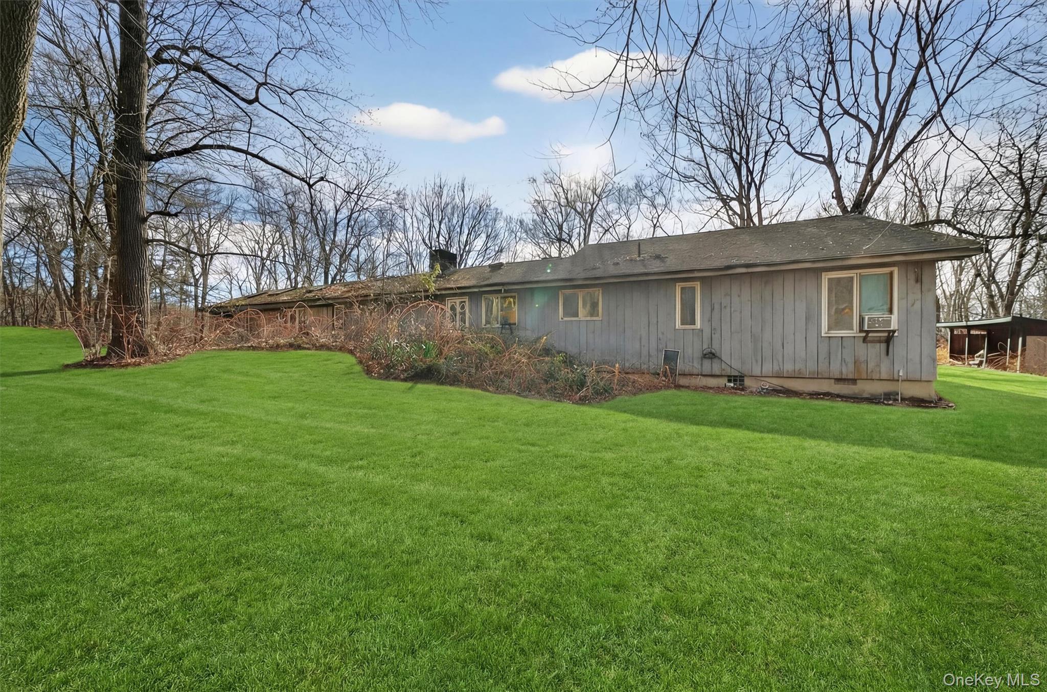 48 Chardavoyne Road Warwick, NY 10990 - Photo 16 of 22 a backyard of a house with lots of green space