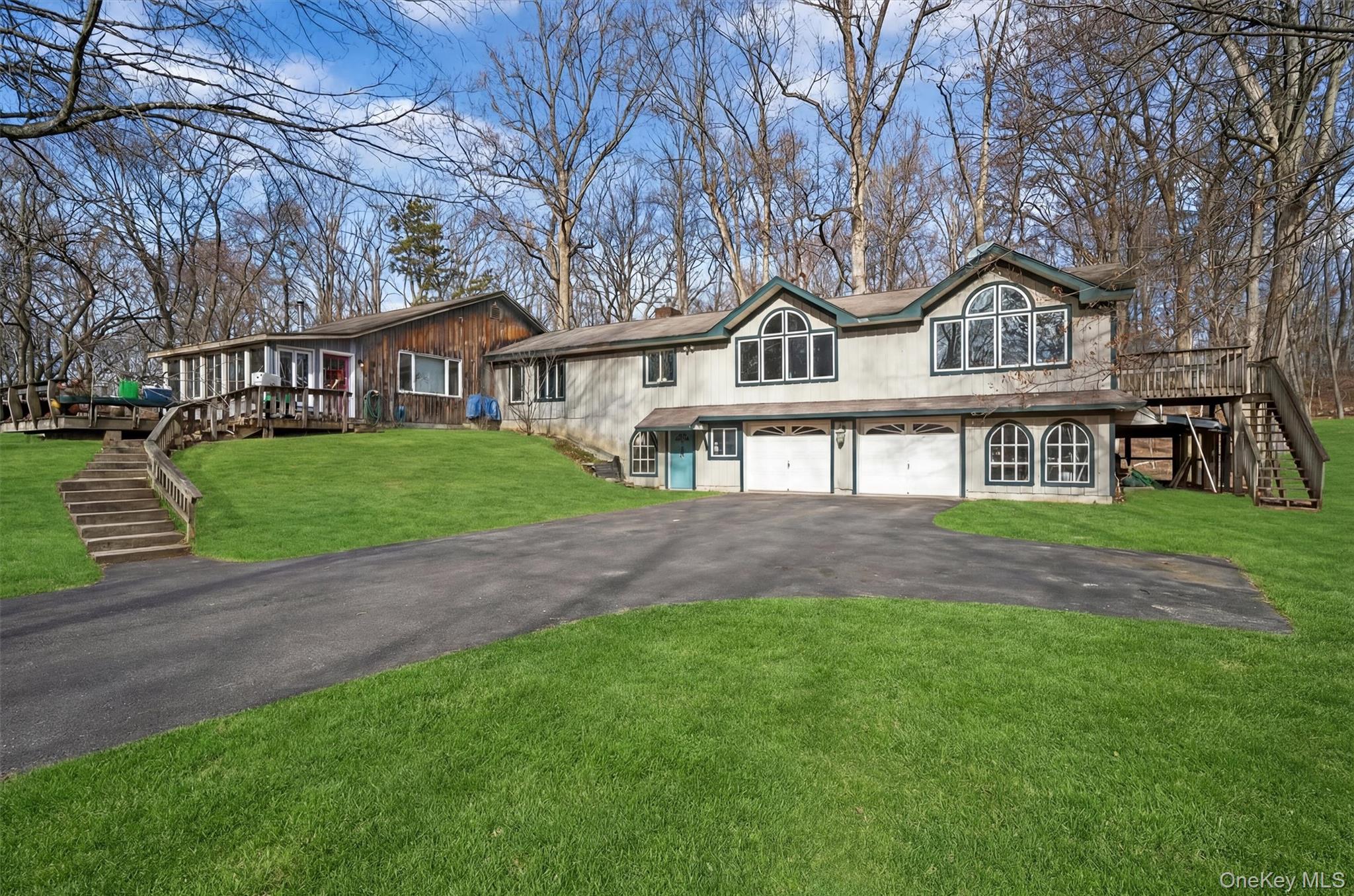 48 Chardavoyne Road Warwick, NY 10990 - Photo 3 of 22 a front view of a house with a garden and trees