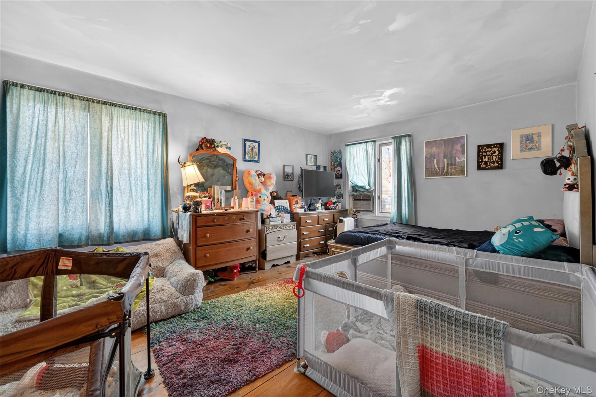 48 Chardavoyne Road Warwick, NY 10990 - Photo 6 of 22 a living room with furniture and a flat screen tv