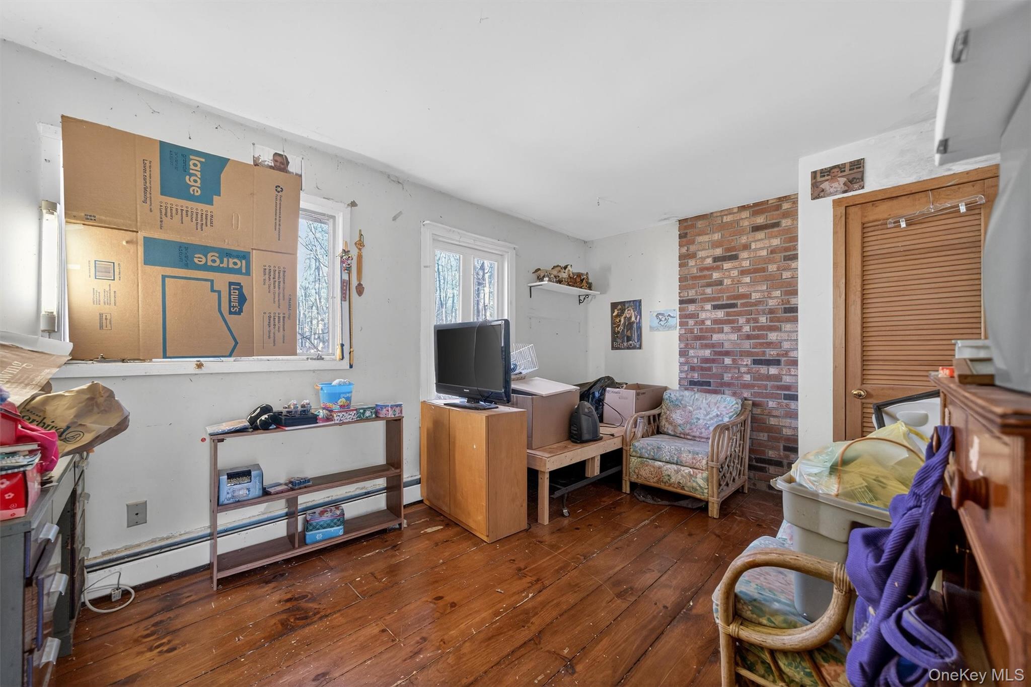 48 Chardavoyne Road Warwick, NY 10990 - Photo 9 of 22 a living room with furniture and a flat screen tv