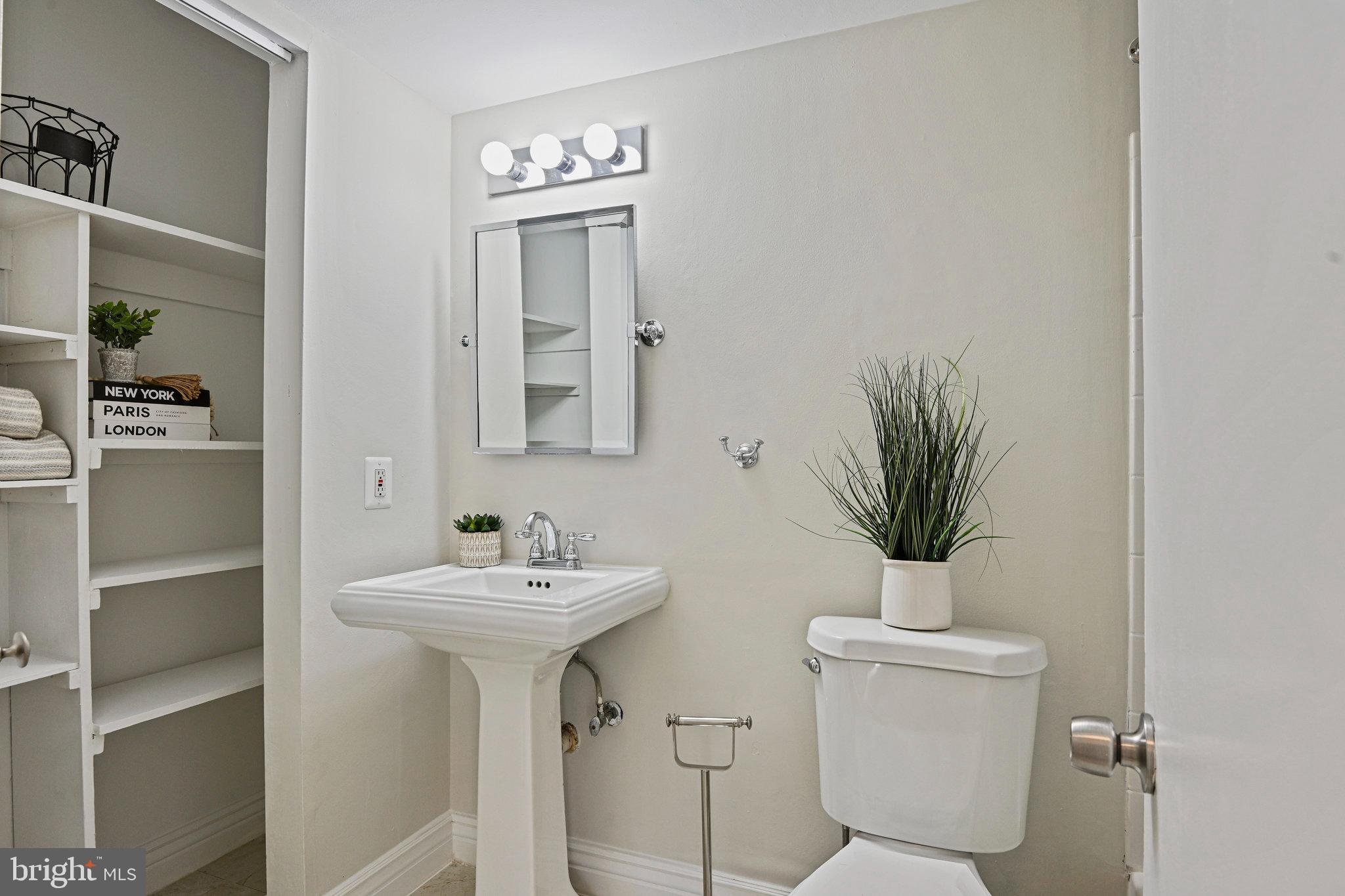 11625 Vantage Hill Road, Unit C Reston, VA 20190 - Photo 13 of 35 a bathroom with a toilet sink and mirror